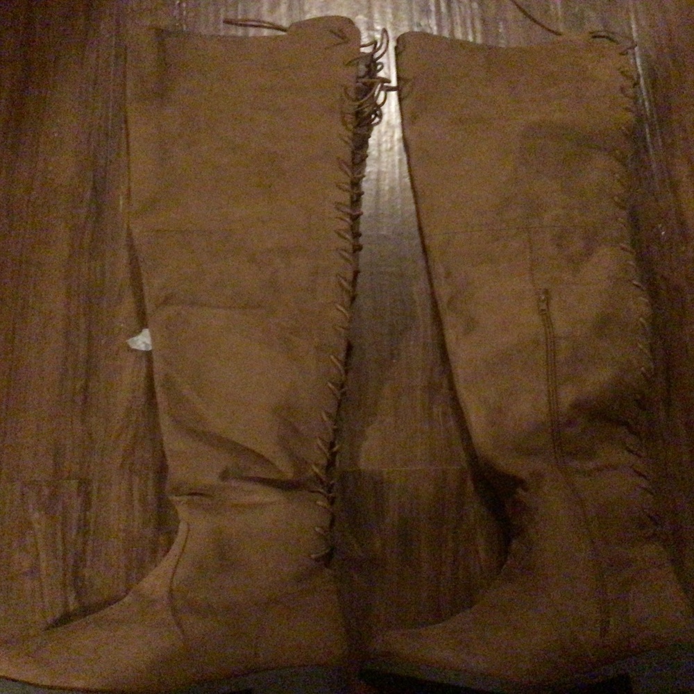 Thigh high lace up boot